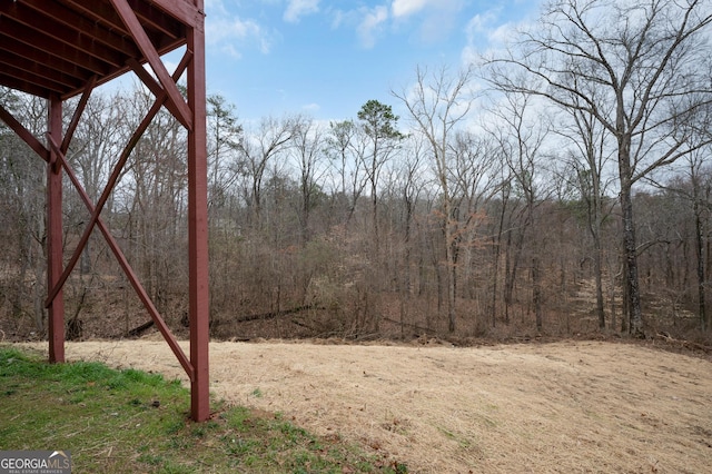 view of yard featuring a view of trees