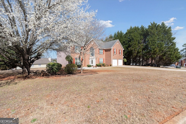 view of front of house with an attached garage and driveway