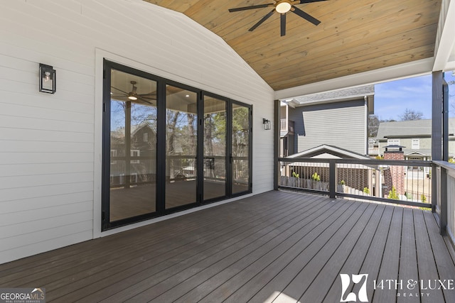 wooden deck with a ceiling fan