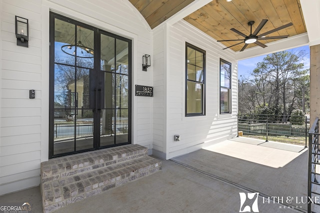 property entrance featuring ceiling fan and covered porch