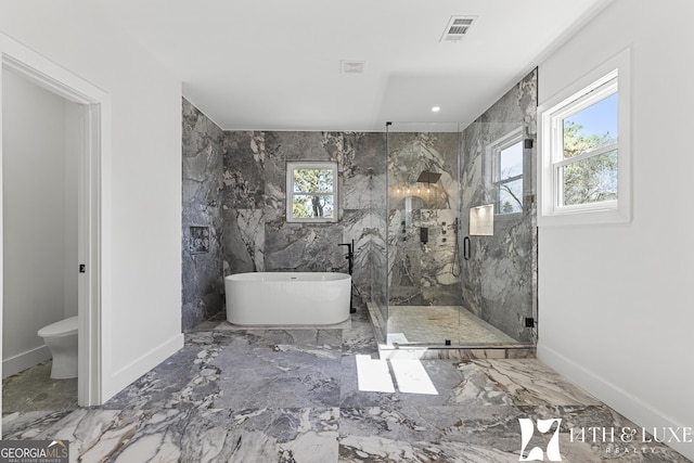 full bath featuring a marble finish shower, baseboards, visible vents, marble finish floor, and a freestanding tub