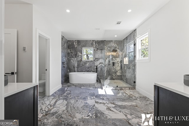 bathroom with recessed lighting, marble finish floor, a soaking tub, and a marble finish shower