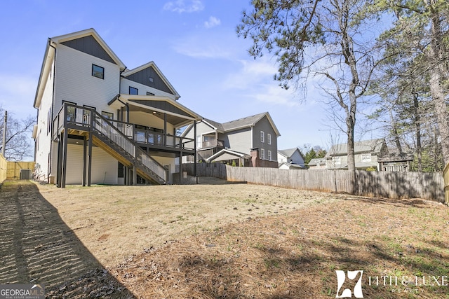 rear view of property with a fenced backyard, stairs, central AC unit, and a wooden deck