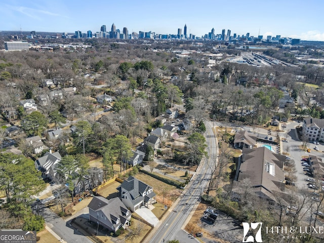 birds eye view of property with a view of city