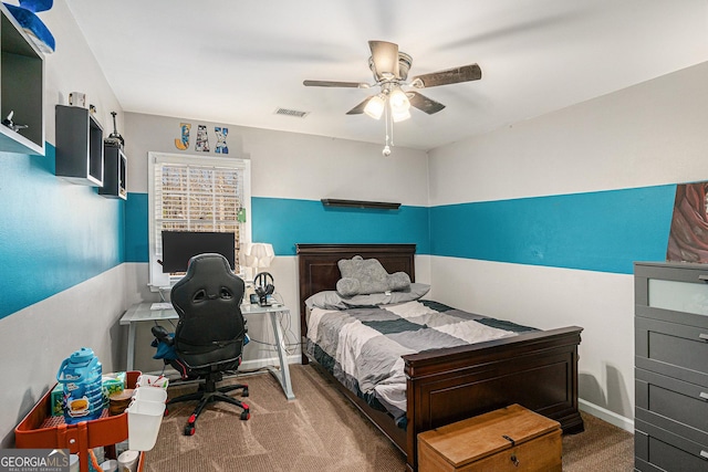 carpeted bedroom with visible vents and a ceiling fan