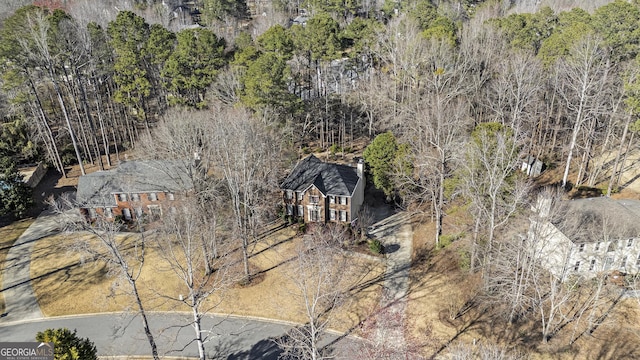 drone / aerial view featuring a view of trees