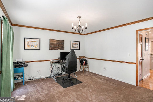 office space with a chandelier, ornamental molding, and carpet floors