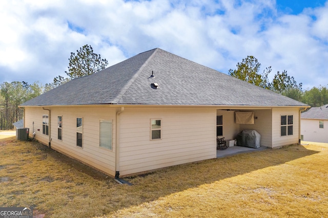 104 Eagle Heights Dr, Maysville, GA 30558 - back of property featuring a shingled roof, cooling unit, a yard, and a patio area