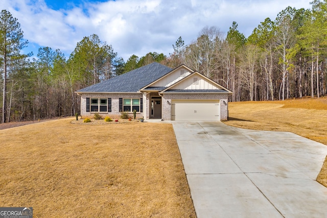 view of front of house with brick siding, concrete driveway, board and batten siding, a garage, and a front lawn