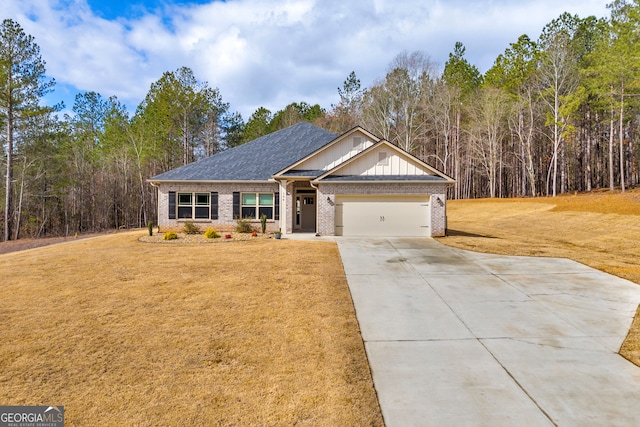 104 Eagle Heights Dr, Maysville, GA 30558 - craftsman-style house with driveway, an attached garage, board and batten siding, brick siding, and a front lawn