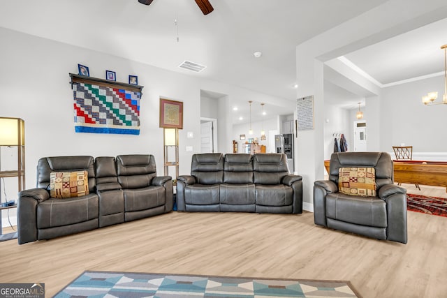 104 Eagle Heights Dr, Maysville, GA 30558 - living room with ceiling fan with notable chandelier, visible vents, crown molding, and wood finished floors