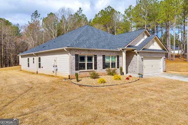 craftsman house with a garage, brick siding, driveway, roof with shingles, and a front yard