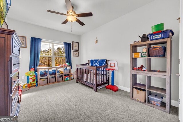 104 Eagle Heights Dr, Maysville, GA 30558 - carpeted bedroom featuring a crib, baseboards, and ceiling fan