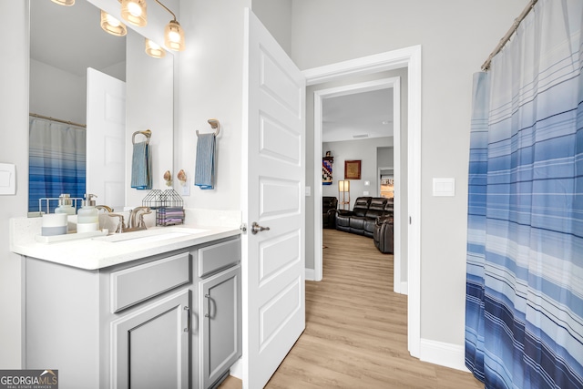 104 Eagle Heights Dr, Maysville, GA 30558 - bathroom with vanity, baseboards, and wood finished floors
