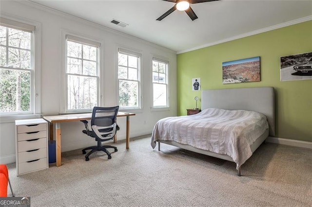 bedroom featuring light carpet, ornamental molding, visible vents, and baseboards