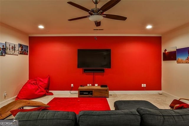 living room with carpet floors, ornamental molding, baseboards, and ceiling fan