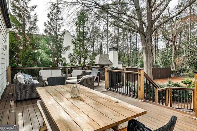 wooden deck featuring outdoor lounge area