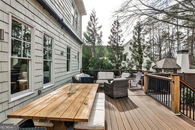 wooden terrace featuring an outdoor hangout area