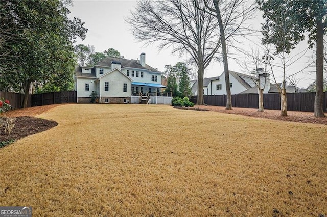 view of yard featuring a fenced backyard