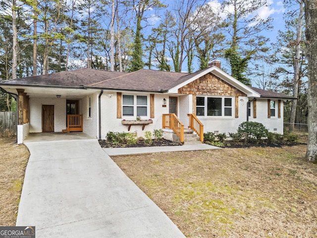 ranch-style house featuring concrete driveway, brick siding, fence, and a chimney