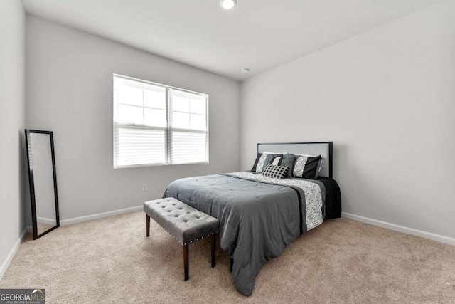 carpeted bedroom featuring baseboards