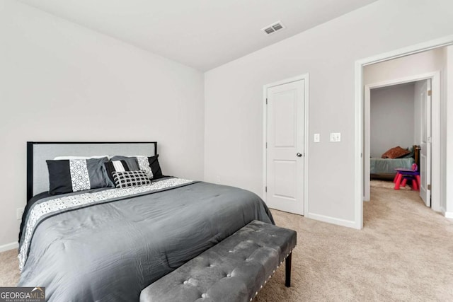 bedroom with carpet, visible vents, and baseboards