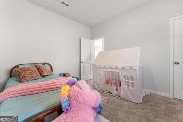 bedroom featuring carpet, visible vents, and baseboards