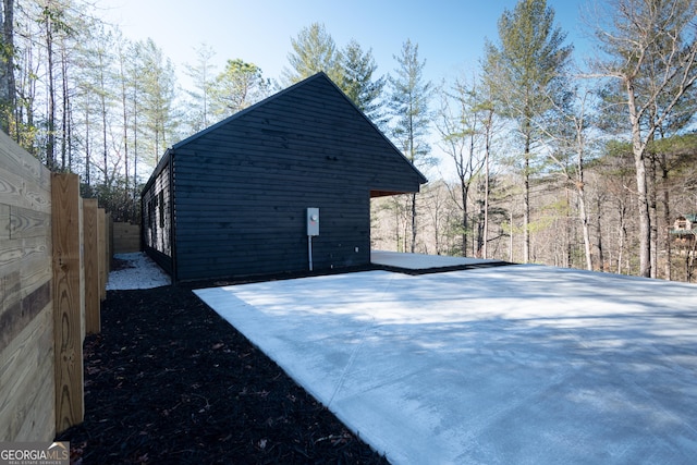 view of side of property with fence