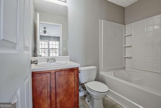 bathroom featuring toilet, a ceiling fan, a textured ceiling, and vanity