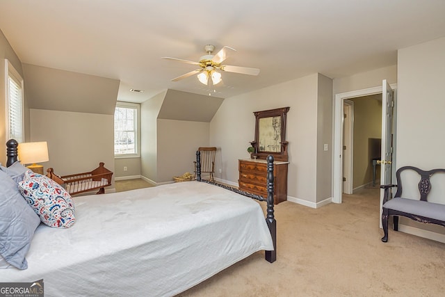 bedroom featuring lofted ceiling, light colored carpet, a ceiling fan, baseboards, and visible vents