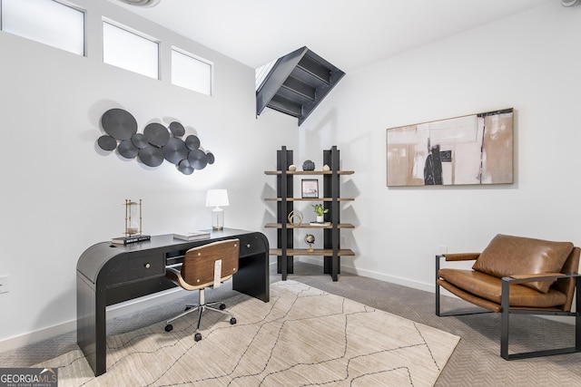 office featuring baseboards and carpet flooring