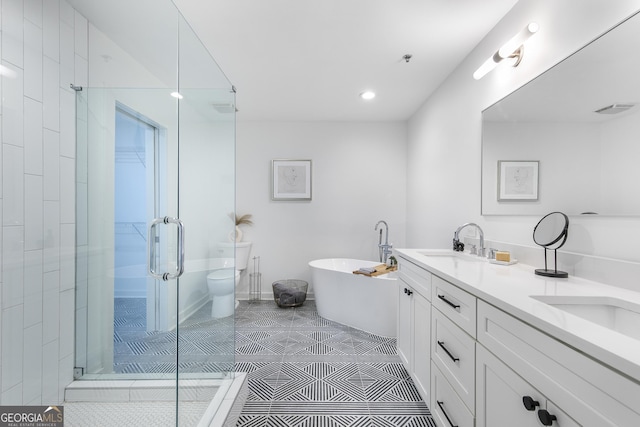 full bath with visible vents, a freestanding bath, a sink, a shower stall, and tile patterned flooring