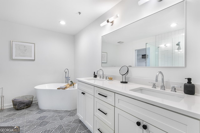 full bathroom featuring double vanity, tiled shower, a soaking tub, and a sink