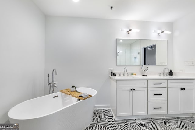 full bath with double vanity, tile patterned flooring, a sink, and a shower stall