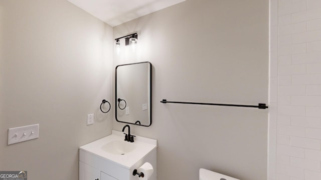 bathroom with vanity and toilet