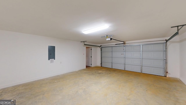 garage with baseboards, electric panel, and a garage door opener