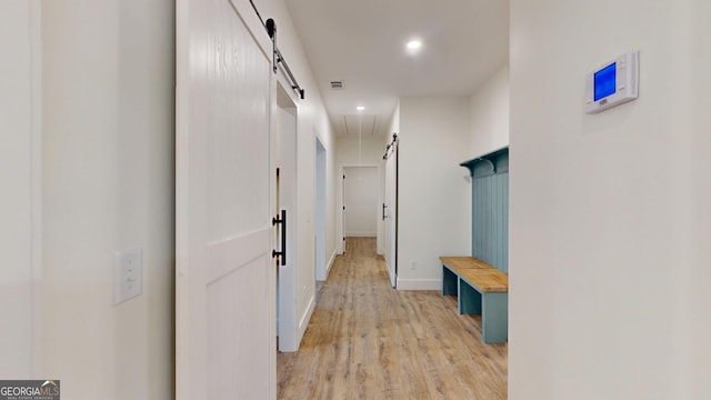 mudroom with attic access, recessed lighting, light wood-style flooring, and baseboards