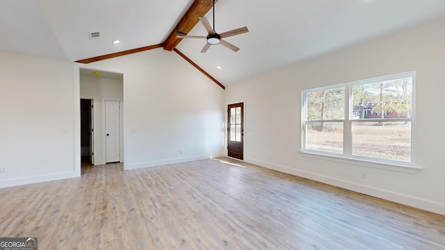 unfurnished room featuring wood finished floors, a ceiling fan, visible vents, baseboards, and beamed ceiling