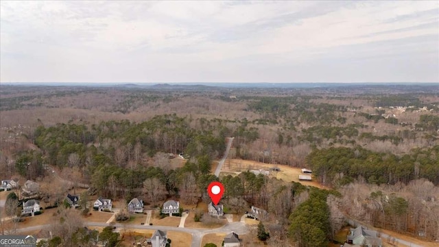 drone / aerial view with a view of trees