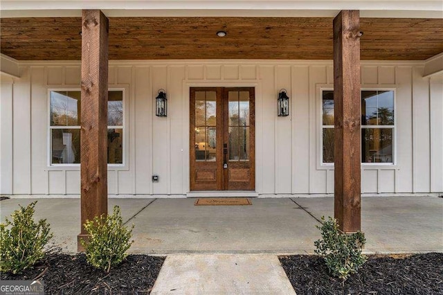 view of exterior entry featuring board and batten siding