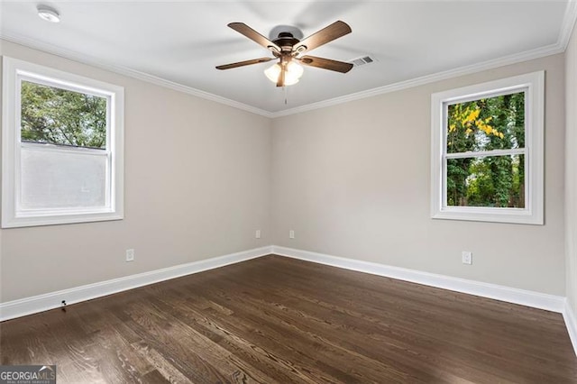 unfurnished room with ceiling fan, dark wood-type flooring, crown molding, and baseboards