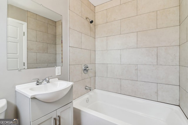 bathroom with shower / washtub combination, toilet, and vanity