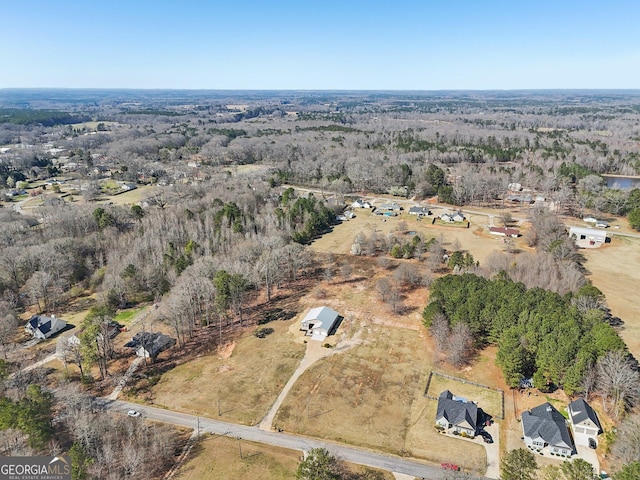 bird's eye view featuring a view of trees