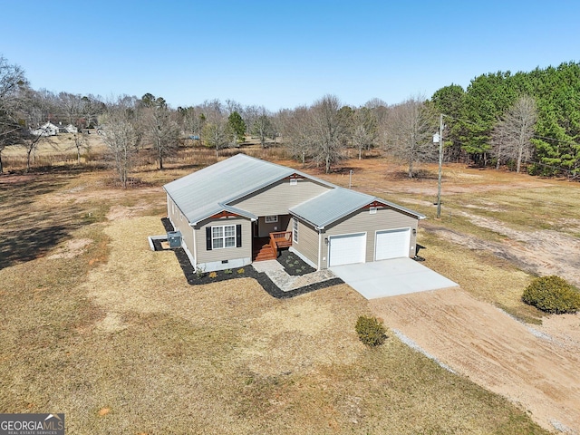 view of front of home with crawl space, concrete driveway, a garage, and metal roof