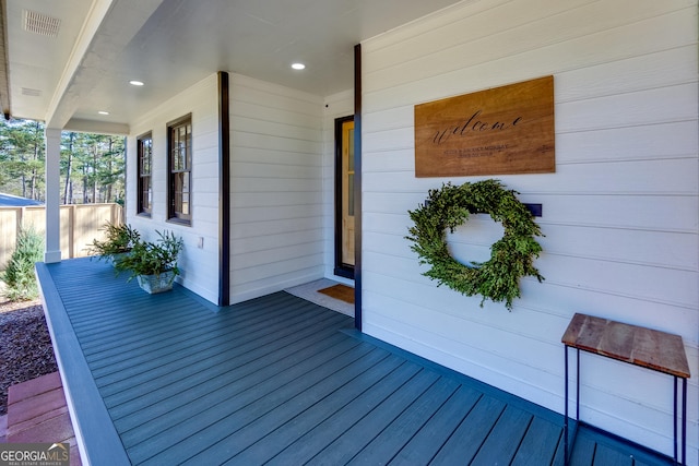 wooden deck featuring covered porch