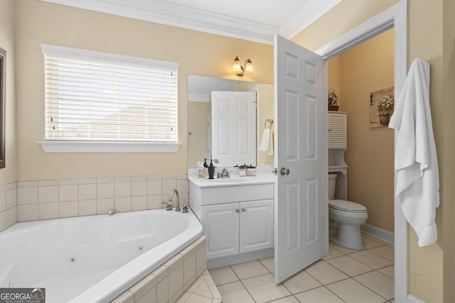 bathroom with toilet, ornamental molding, vanity, a tub with jets, and tile patterned floors