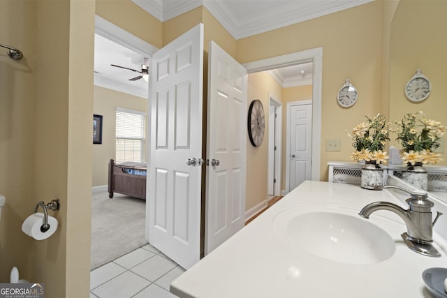 bathroom featuring ceiling fan, ornamental molding, tile patterned flooring, and vanity