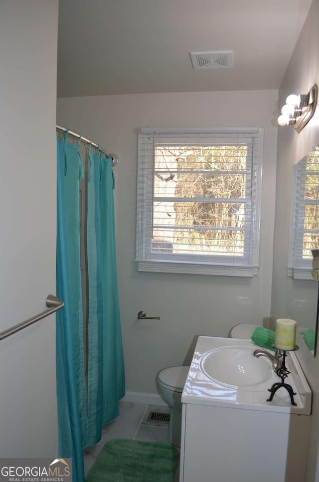 full bathroom with marble finish floor, visible vents, vanity, and toilet