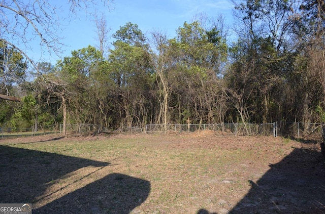 view of yard featuring fence