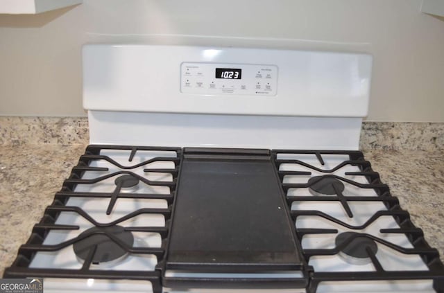 interior details featuring range with gas cooktop